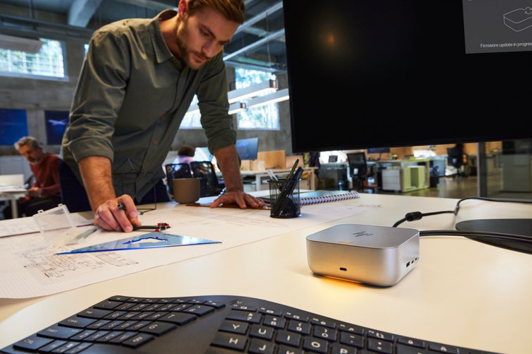 photo of an office with an HP docking station in the foreground